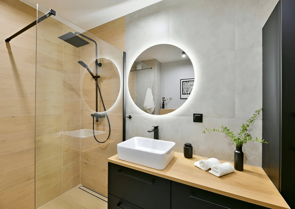 back-lit round bathroom mirror